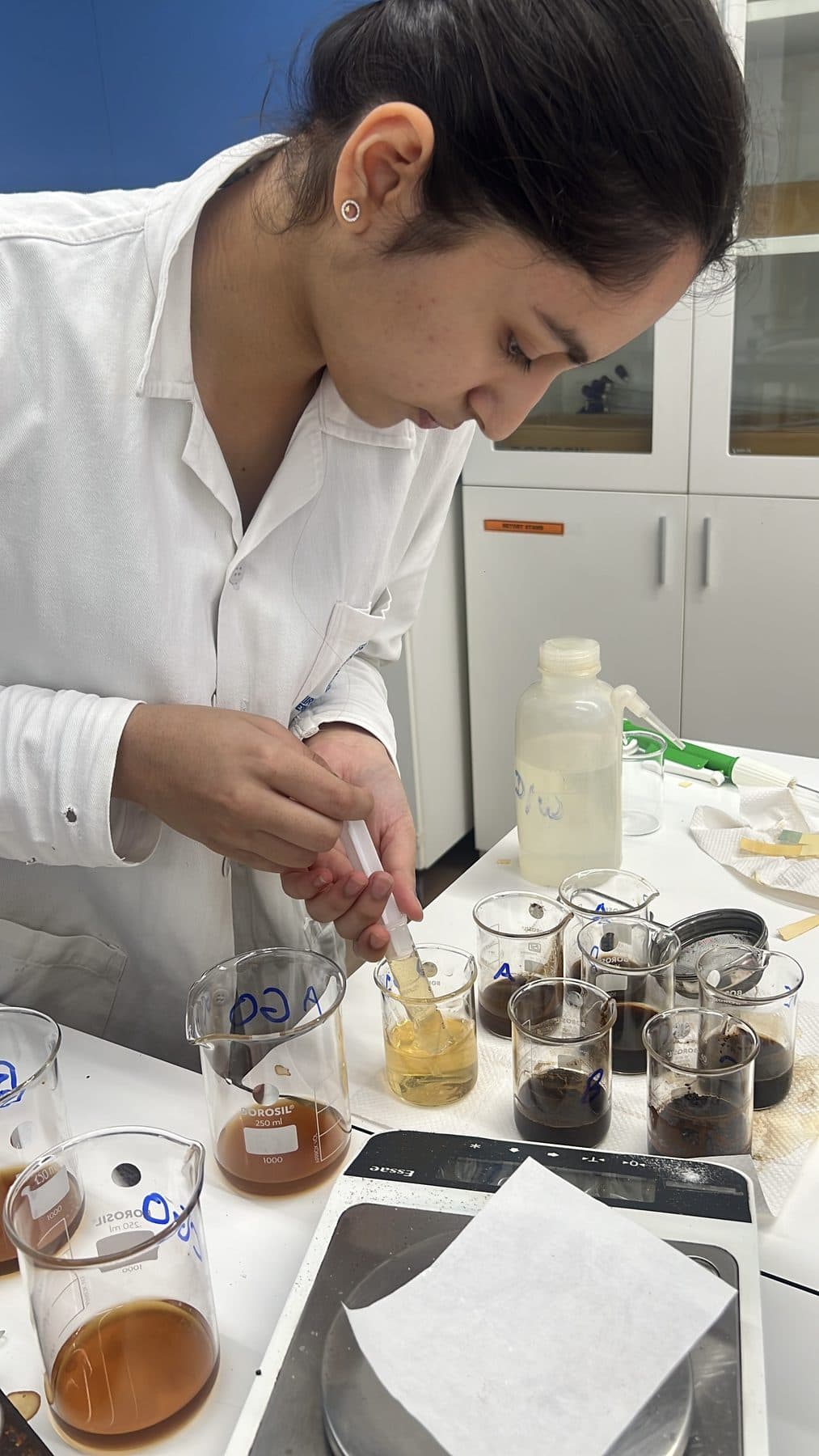 Student preparing a series of sample solutions